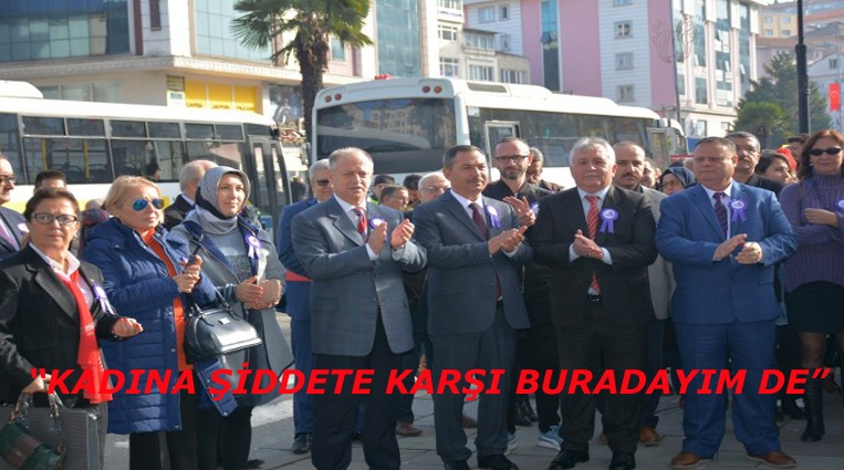 “KADINA ŞİDDETE KARŞI BURADAYIM DE”.